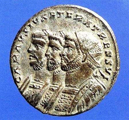 One side of a Roman Coin deicptiing from right to left: Carausius, Diocletian, and Maximian