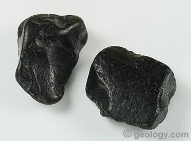 Two irregular pieces of Whitby jet pieces