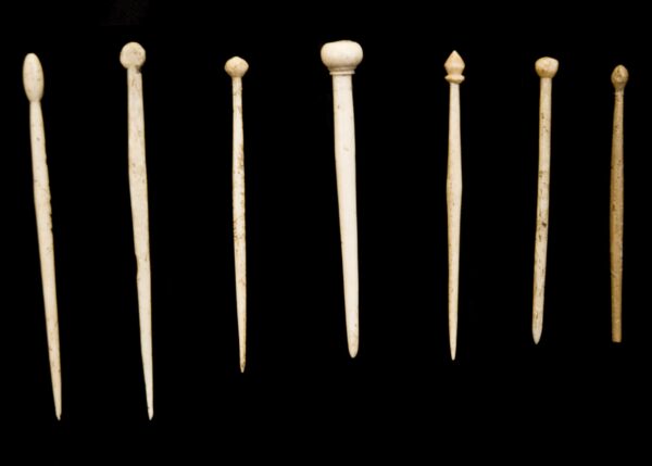 7 bone hair pins.